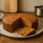 Photo d’un gâteau spéculoos maison moelleux et doré, préparé dans une cuisine familiale et servi pour un goûter gourmand.